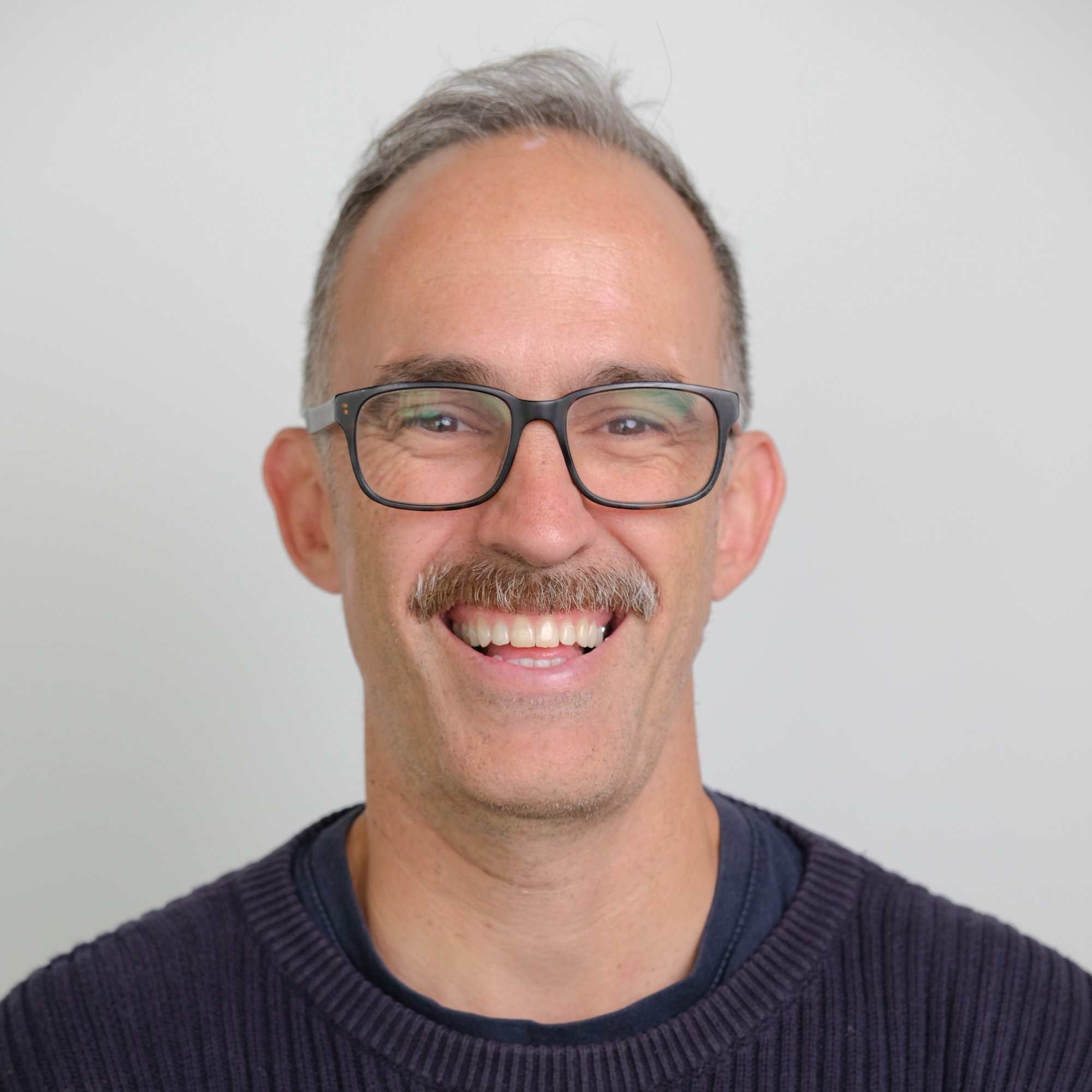Headshot of Alasdair McCall